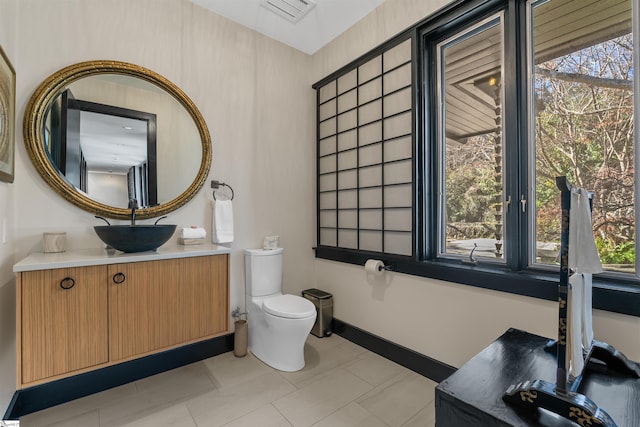 bathroom with vanity and toilet