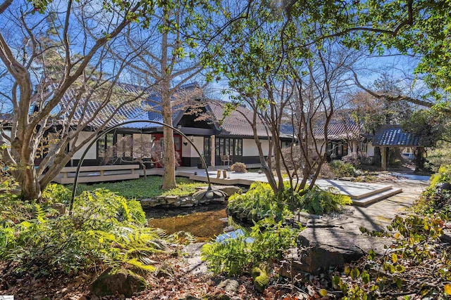 view of community featuring an outdoor living space and a patio area