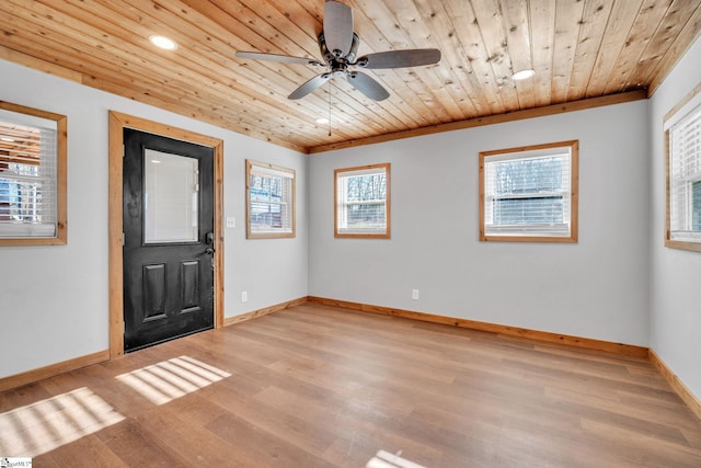 foyer entrance featuring ceiling fan, plenty of natural light, wooden ceiling, and light hardwood / wood-style floors