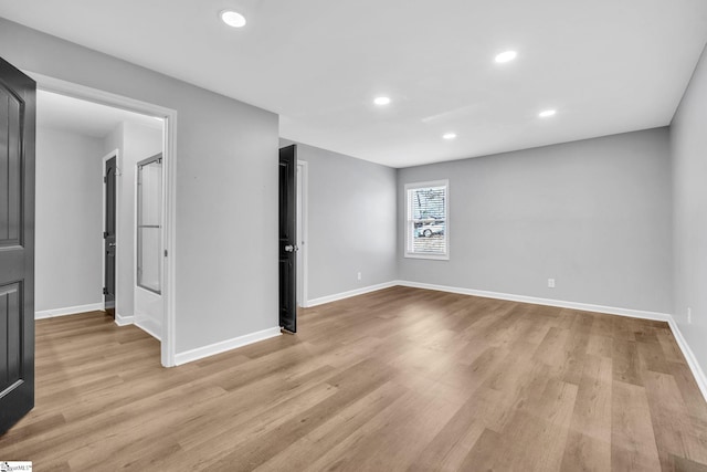 spare room with light hardwood / wood-style floors