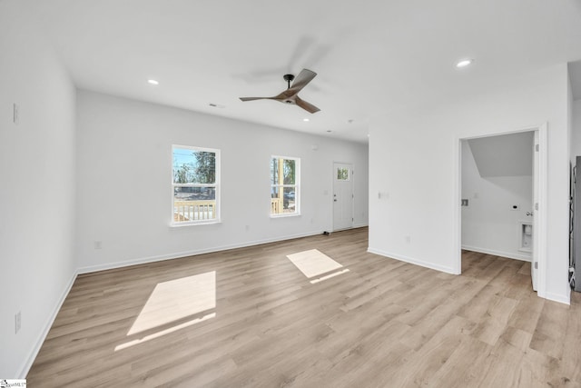 unfurnished living room with ceiling fan and light wood-type flooring