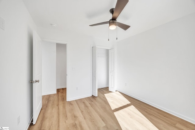 unfurnished bedroom with a closet, ceiling fan, and light hardwood / wood-style floors