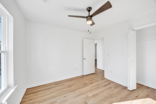 unfurnished bedroom with ceiling fan, light hardwood / wood-style floors, and a closet