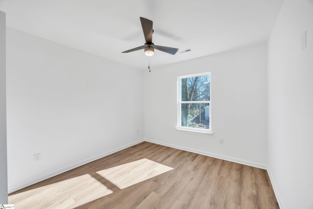 unfurnished room featuring ceiling fan and light hardwood / wood-style flooring