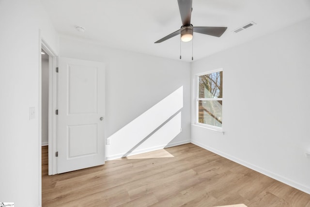 spare room with ceiling fan and light hardwood / wood-style floors