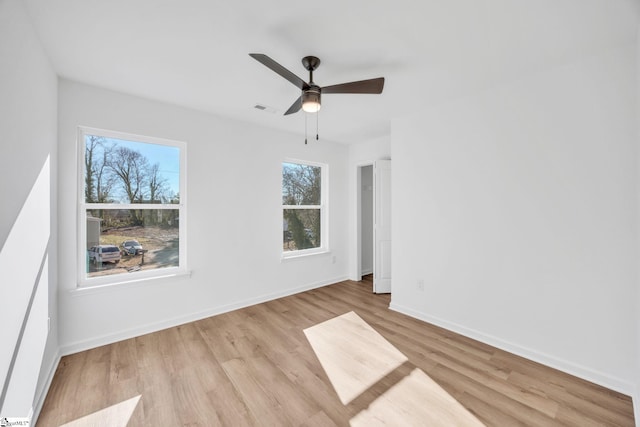 unfurnished room featuring light hardwood / wood-style flooring and ceiling fan