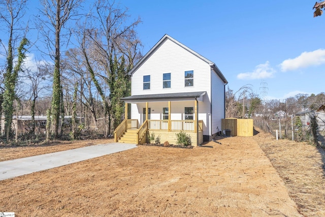 view of front of home featuring central air condition unit and a porch