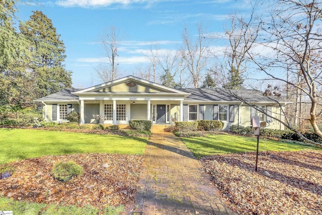 ranch-style house with a front yard and a porch