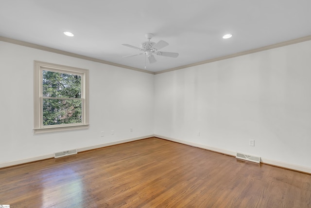 unfurnished room with crown molding, ceiling fan, and hardwood / wood-style flooring