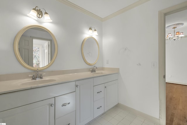 bathroom featuring tile patterned flooring, vanity, and crown molding