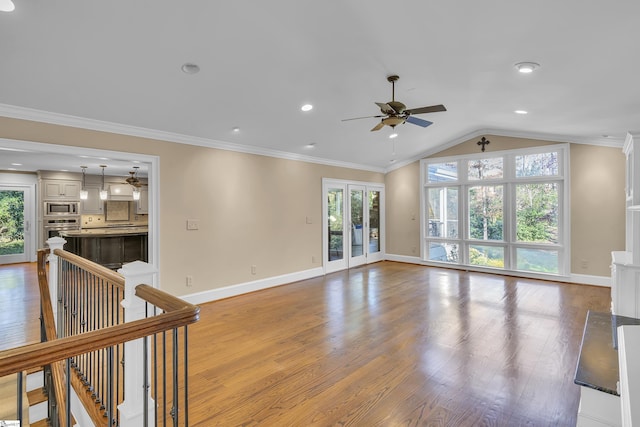 spare room featuring ceiling fan, light hardwood / wood-style flooring, crown molding, and vaulted ceiling