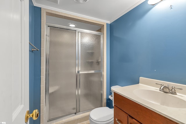 bathroom with toilet, an enclosed shower, crown molding, and vanity