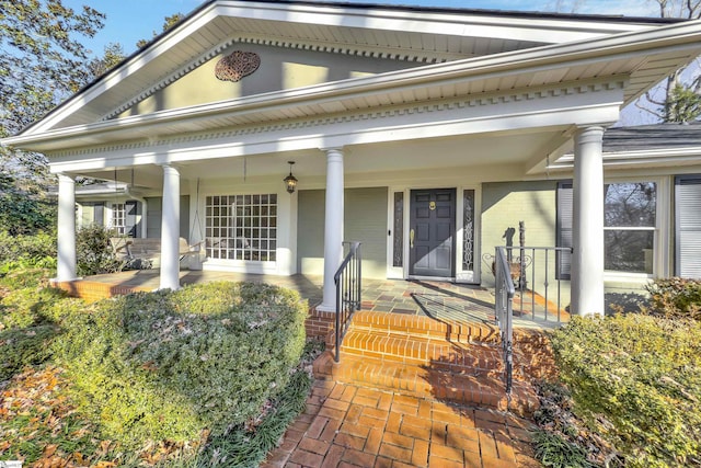 doorway to property featuring covered porch