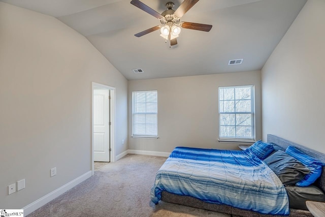 carpeted bedroom featuring multiple windows, ceiling fan, and lofted ceiling