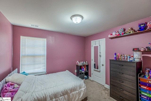 carpeted bedroom featuring a closet