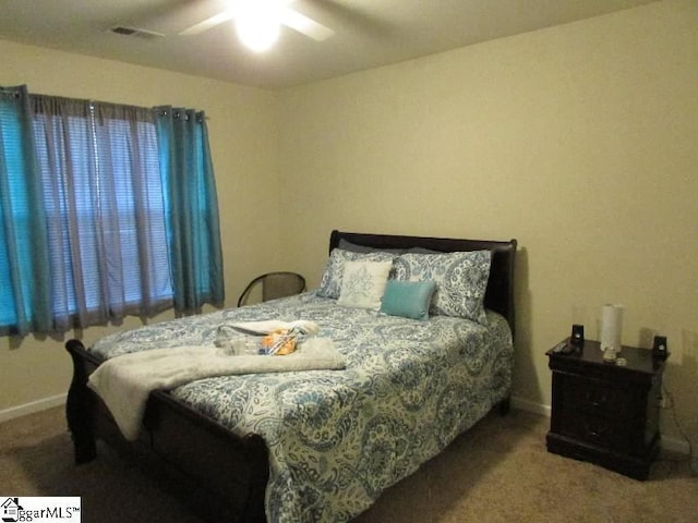 bedroom with ceiling fan and carpet floors