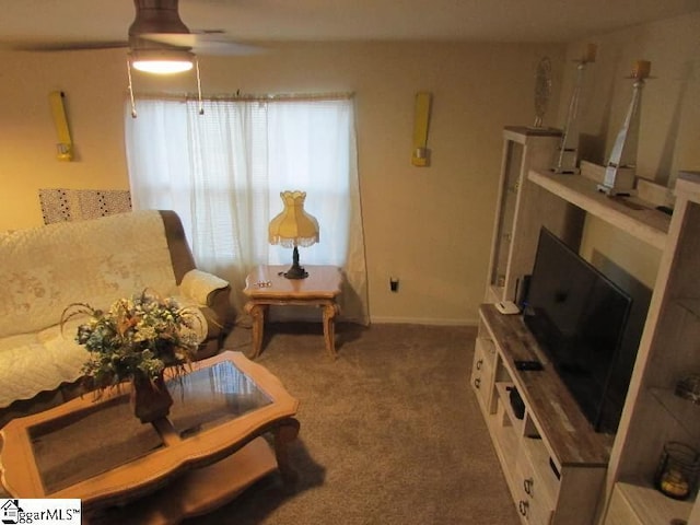 living room with ceiling fan and carpet