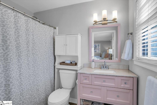 bathroom featuring vanity and toilet