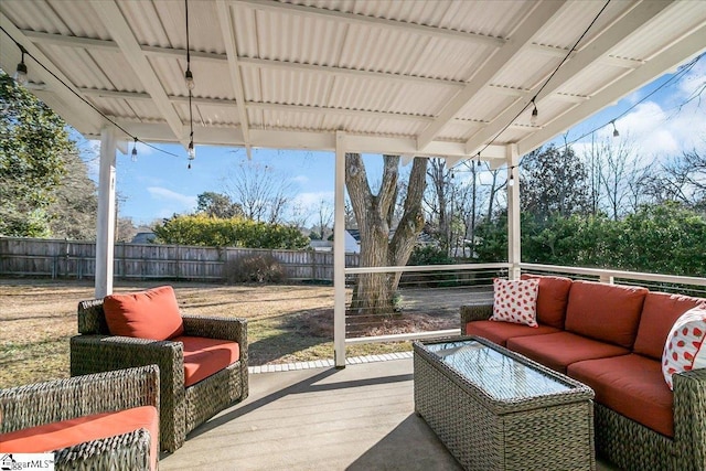 wooden terrace featuring an outdoor hangout area