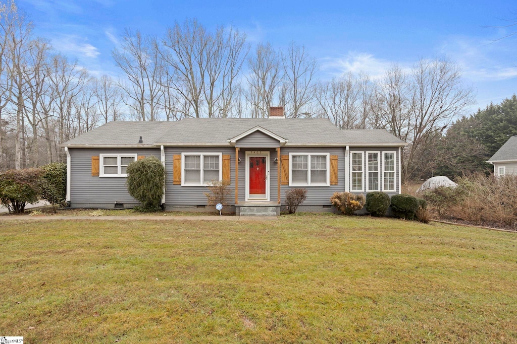 single story home featuring a front yard