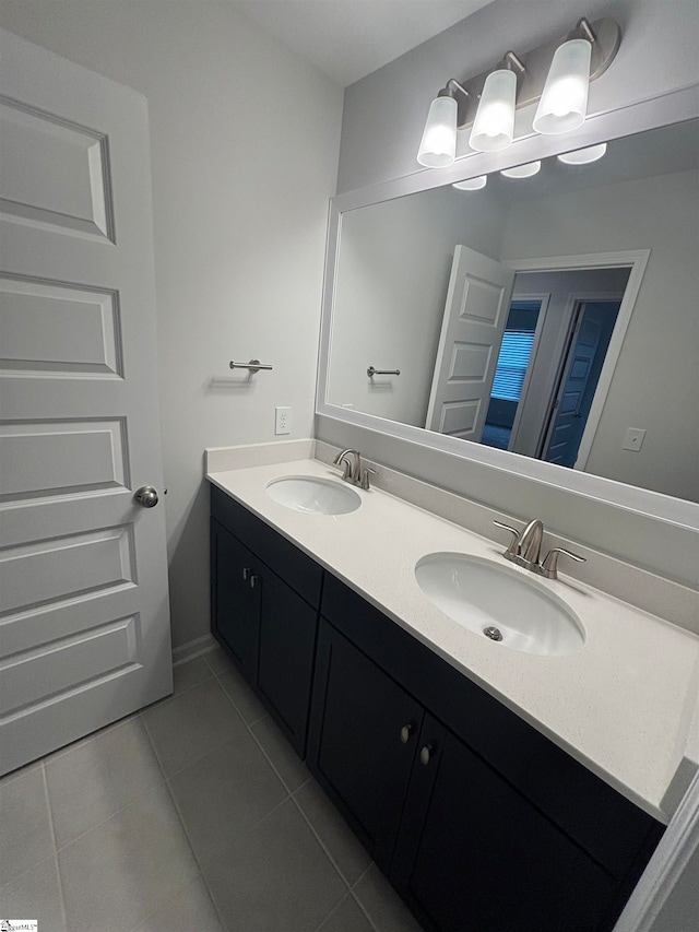 bathroom with tile patterned flooring and vanity