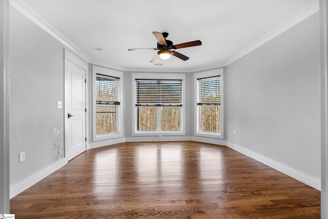 empty room featuring hardwood / wood-style floors, ceiling fan, and crown molding