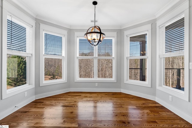 unfurnished sunroom featuring an inviting chandelier