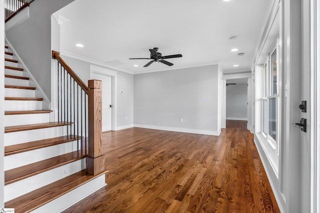 interior space with ceiling fan, crown molding, and dark hardwood / wood-style floors