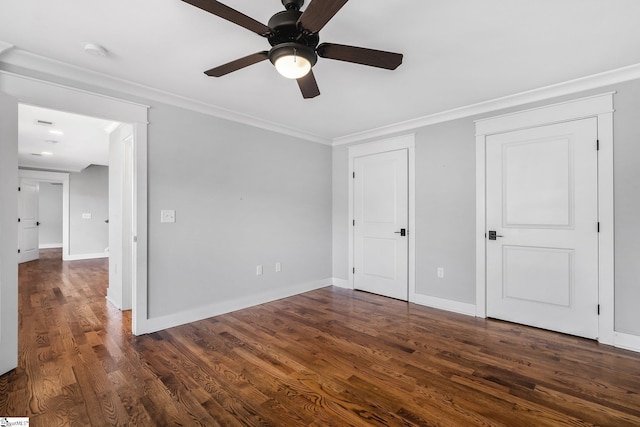 unfurnished bedroom featuring ceiling fan, dark hardwood / wood-style floors, and ornamental molding