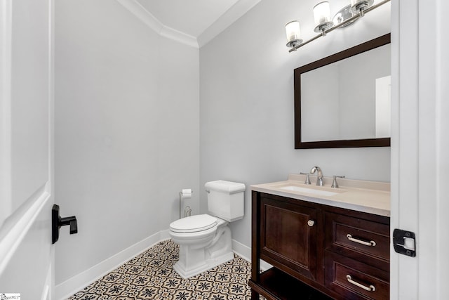 bathroom featuring tile patterned flooring, vanity, toilet, and ornamental molding