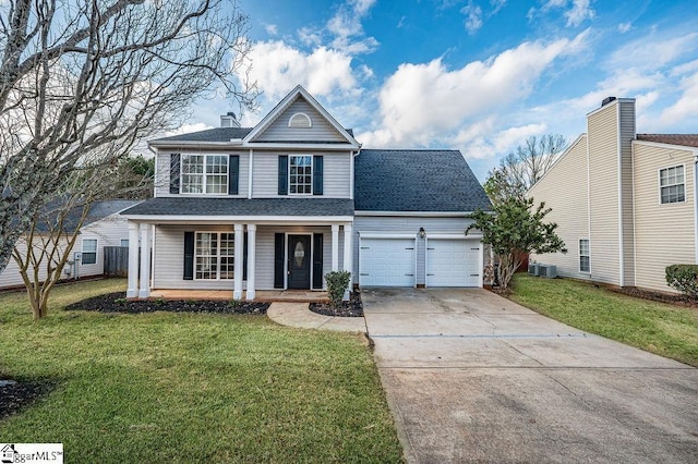 view of front property with covered porch, a garage, and a front lawn