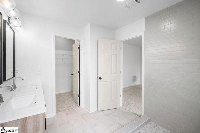 bathroom featuring tile patterned floors and vanity