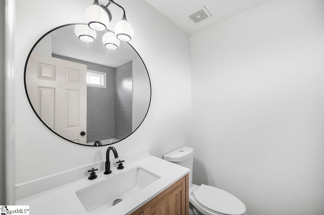 bathroom with vanity and toilet