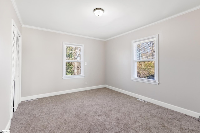 unfurnished bedroom featuring carpet flooring, a closet, and crown molding