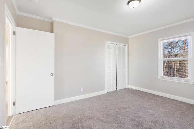 unfurnished bedroom with a closet, light colored carpet, and ornamental molding