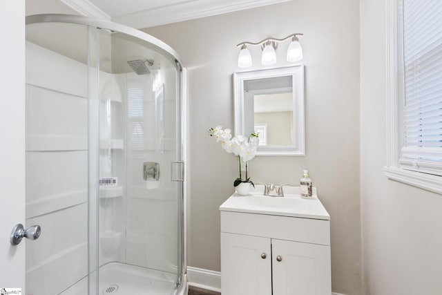 bathroom featuring vanity, walk in shower, and crown molding