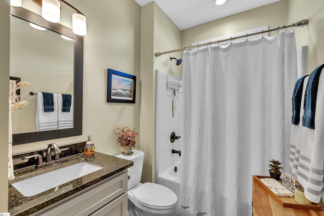 full bathroom featuring shower / bathtub combination with curtain, vanity, and toilet