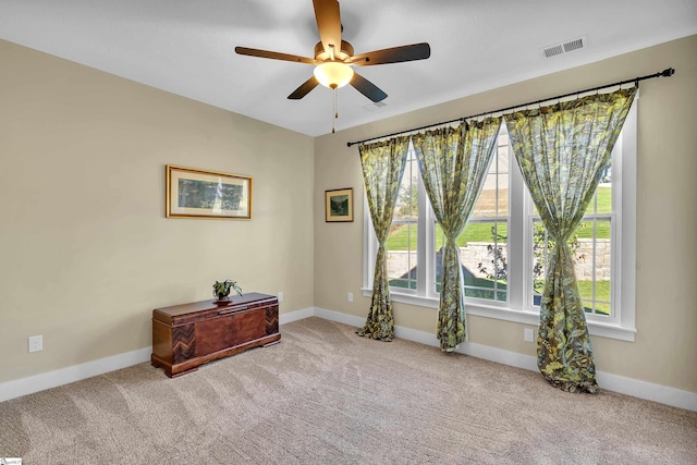 carpeted empty room with ceiling fan