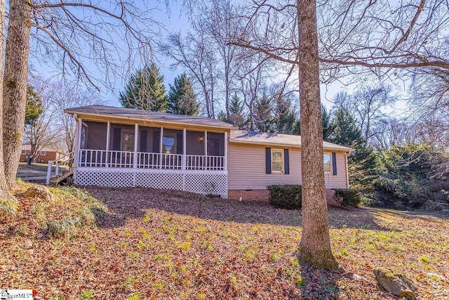 ranch-style home with a sunroom