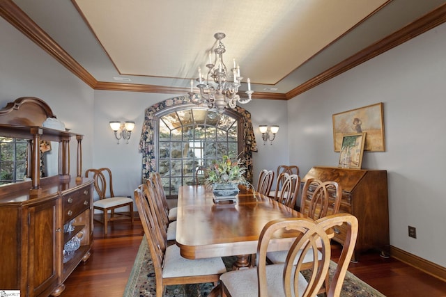 dining area with a chandelier, crown molding, and dark wood-type flooring