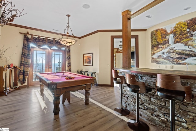 rec room featuring bar area, wood-type flooring, french doors, and billiards