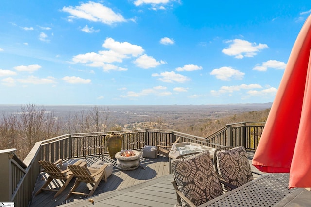 wooden deck featuring a fire pit