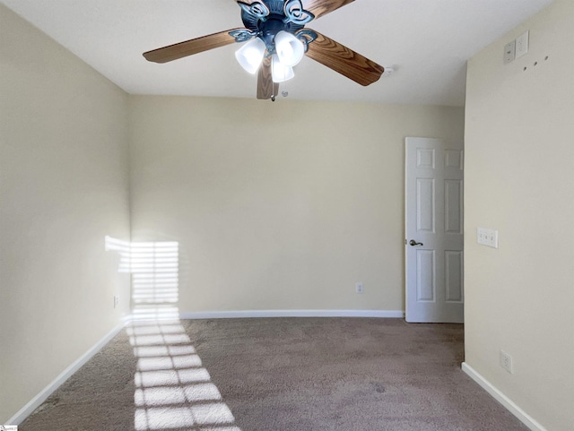 carpeted empty room featuring ceiling fan