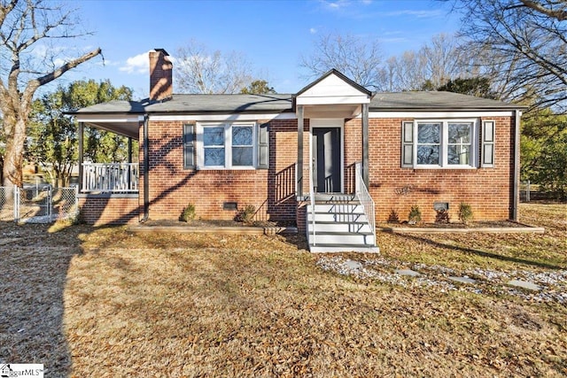 bungalow-style house featuring a front yard