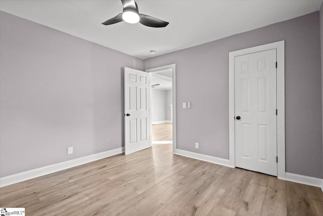 unfurnished bedroom featuring ceiling fan and light hardwood / wood-style flooring