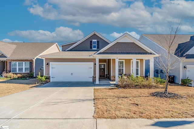 craftsman-style home featuring a porch and a garage