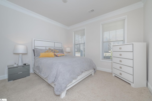 bedroom with light colored carpet and ornamental molding