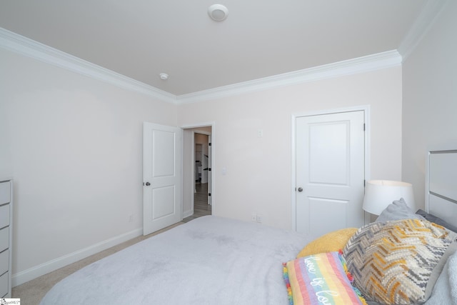 carpeted bedroom with crown molding