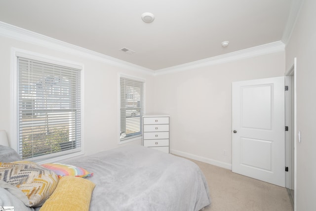 bedroom featuring crown molding and light colored carpet