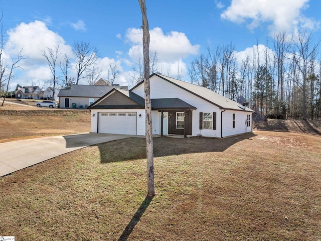 ranch-style house with a garage and a front lawn